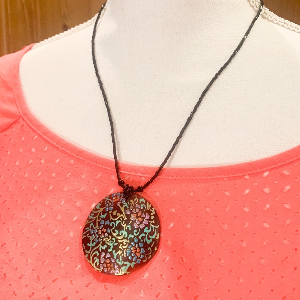 Multi colored medallion necklace with black beads